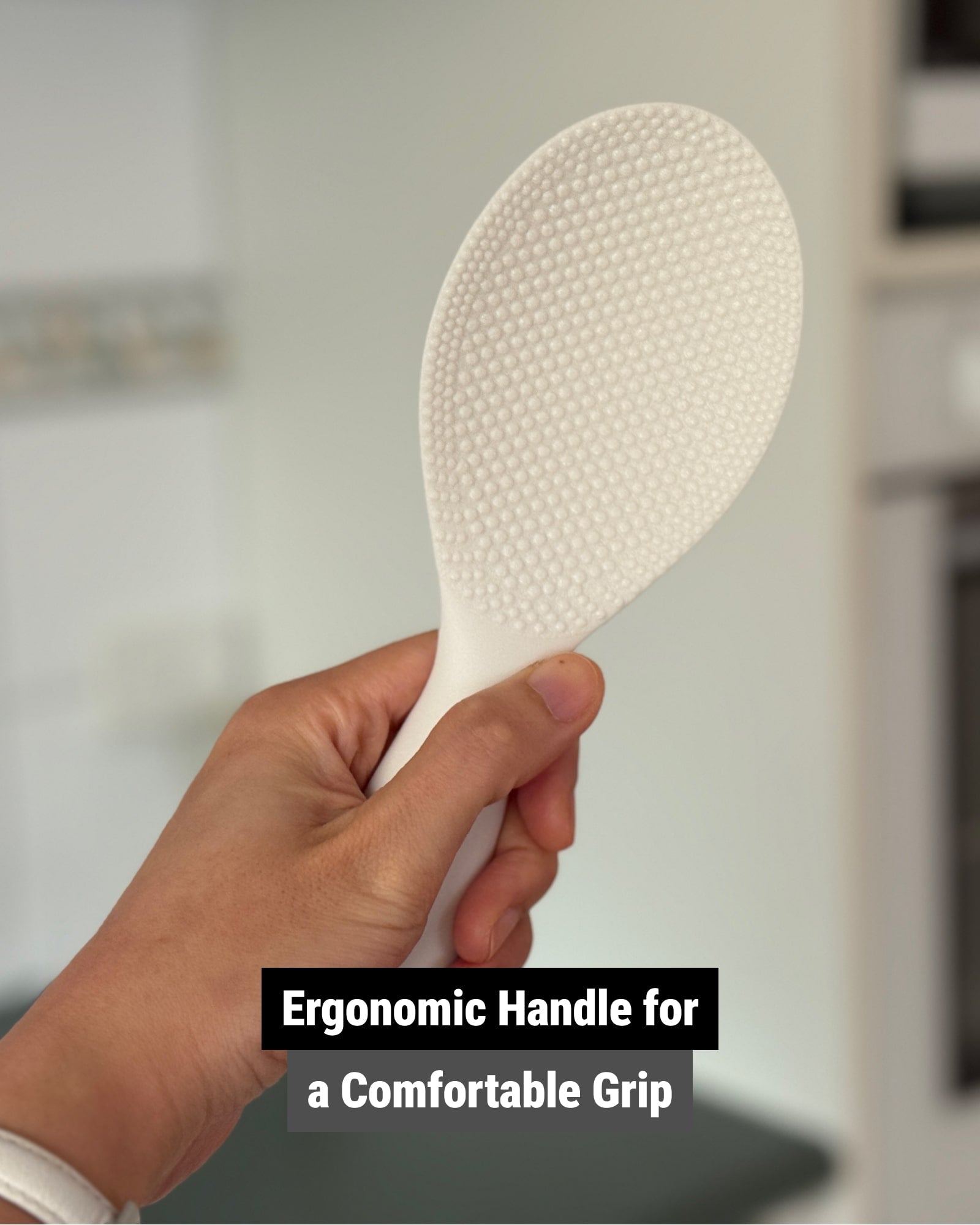 The rice scooper with an ergonomic handle for a comfortable grip.