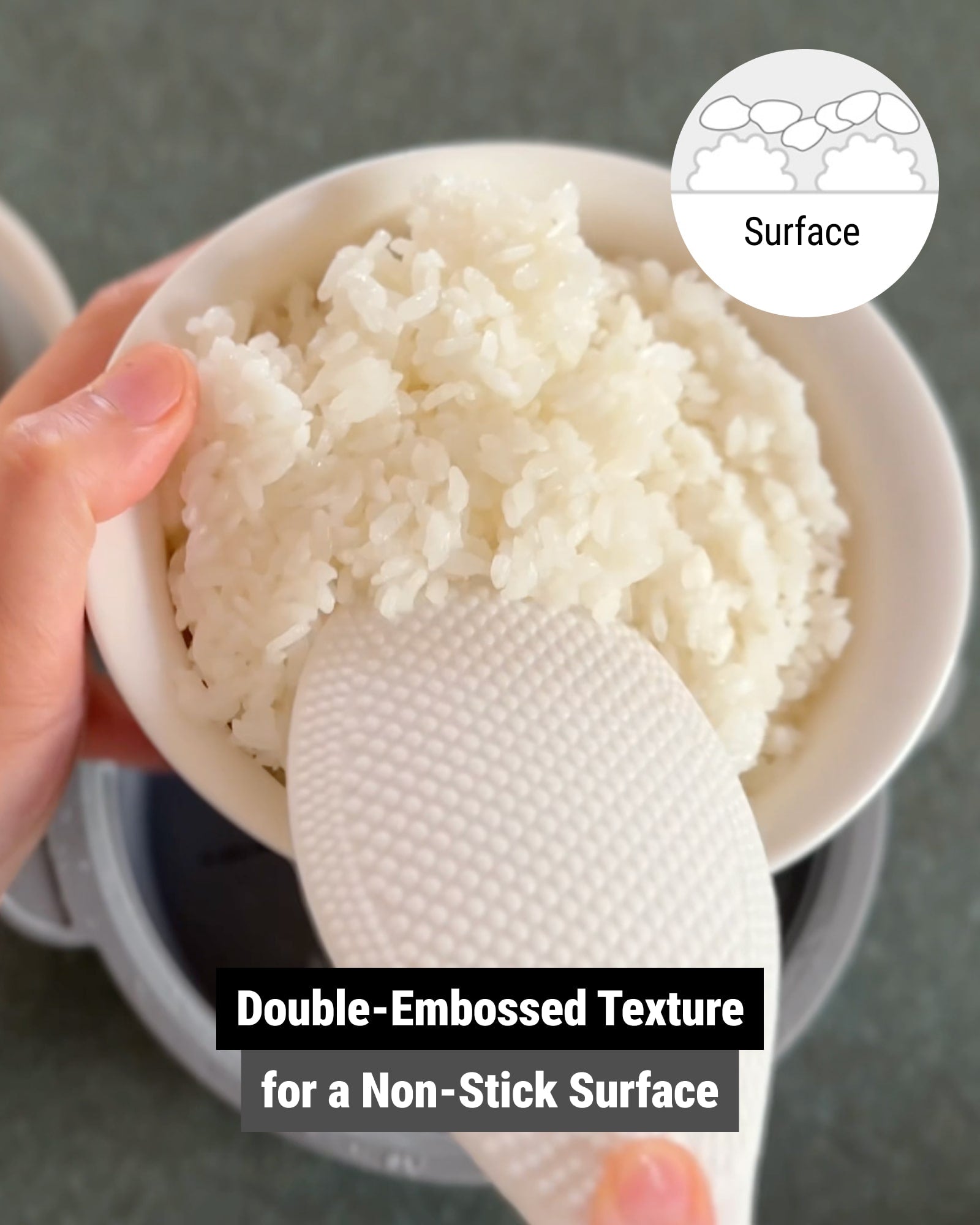 The rice scooper showing a double-embossed texture for preventing rice from sticking.
